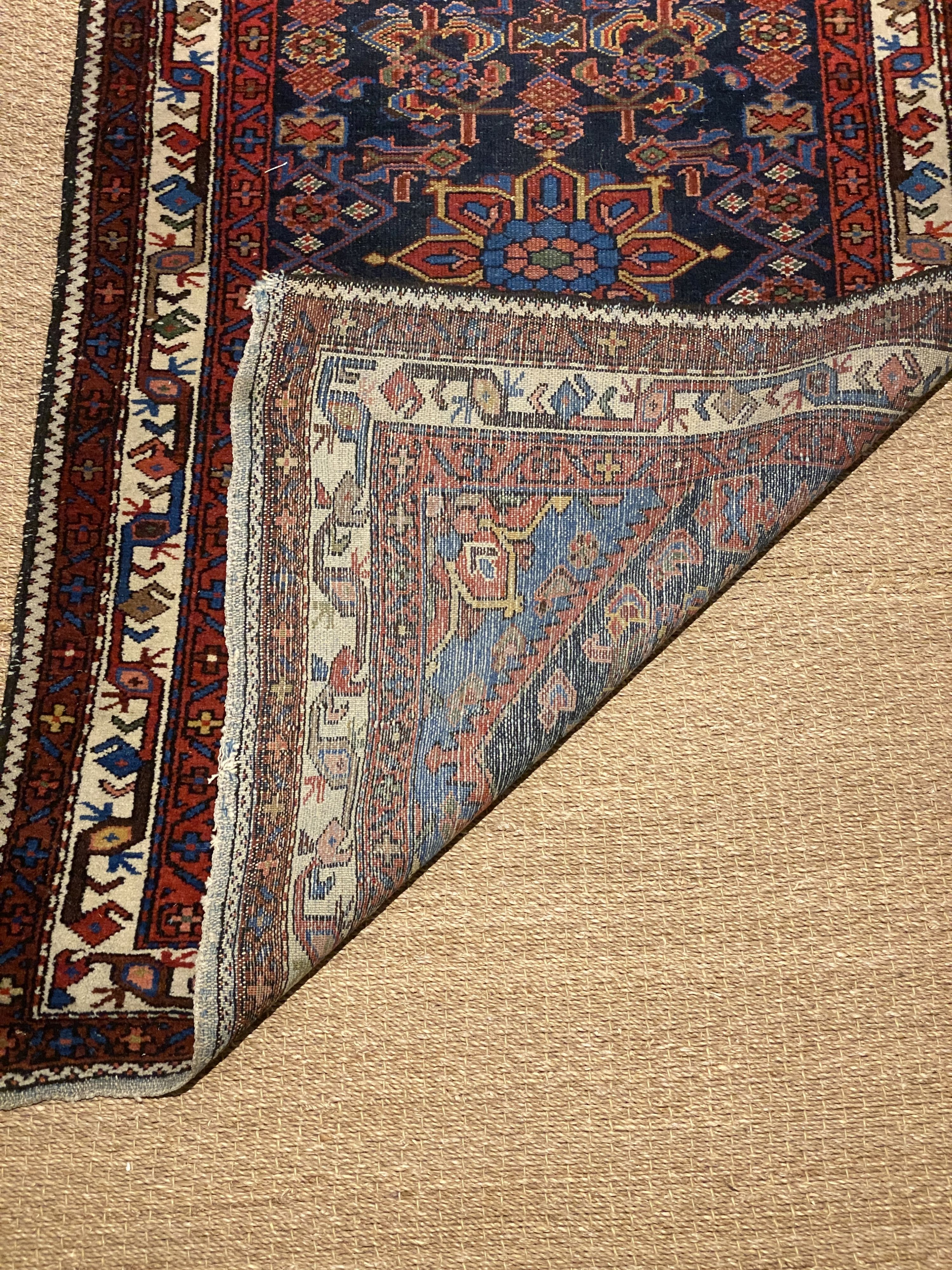 A Caucasian blue ground rug, triple bordered, 157 x 97cm